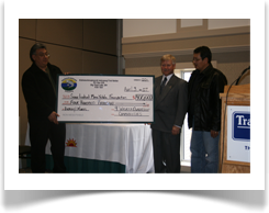 KI Chief Donny Morris presents cheque to Menoyawin Health Centre Board member Harvey Friesen